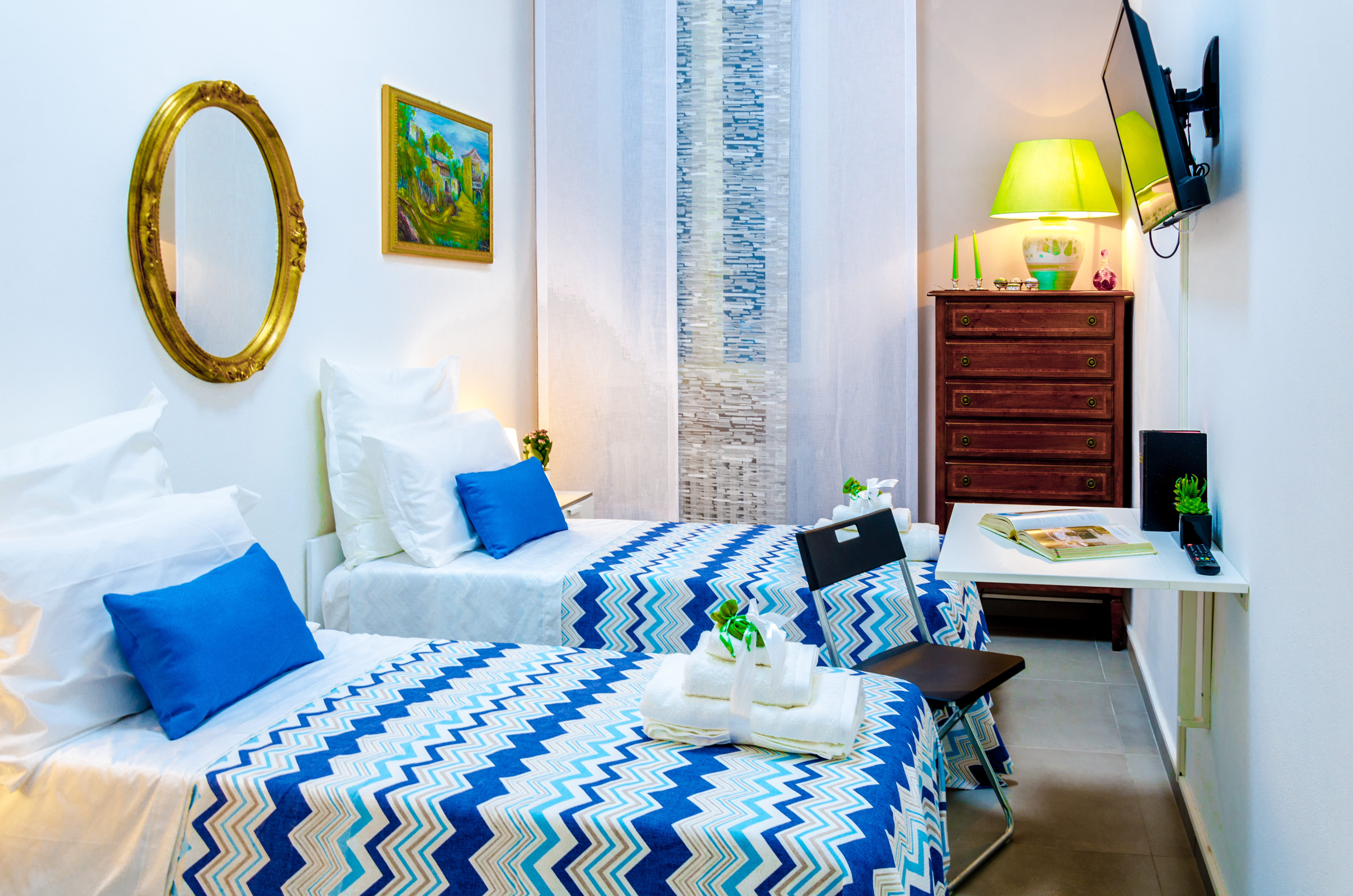 Bright twin room with lime green accents